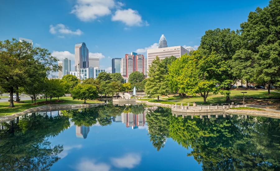 Skyline view of Charlotte with lush greenery near Carowinds amusement park, North Carolina.