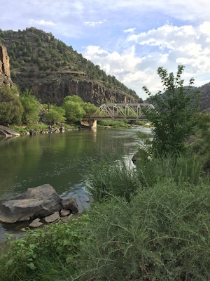 This swimming hole deep in the Rio Grande Gorge is both lovely and refreshing! Visitors spread out along the banks for a dip in the cool waters, and rock climbers ascend both sides of the canyon walls.
