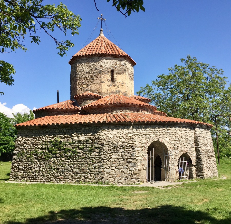 Dzveli-Gavazi Church, in Akhalsopeli, half way between Kvareli and Lagodekhi, Kakheti, Georgia. The original church, dated to the 6th century, was a simple structure with 4 apses and a dome. In the 8th-9th century it was surrounded by an ambulatory and the done was heightened.