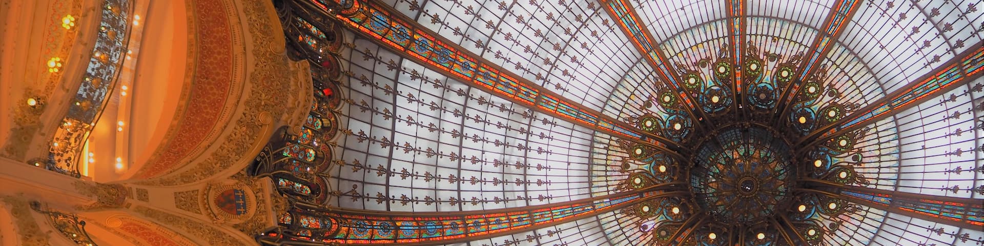 Huge store in Paris with the most amazing domed stained glass roof.