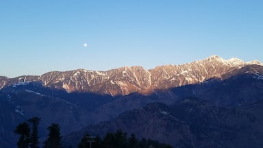 Moon, Sunlight, Snow and Mountains, view from Cedarwood Resort, KPK, Pakistan. 