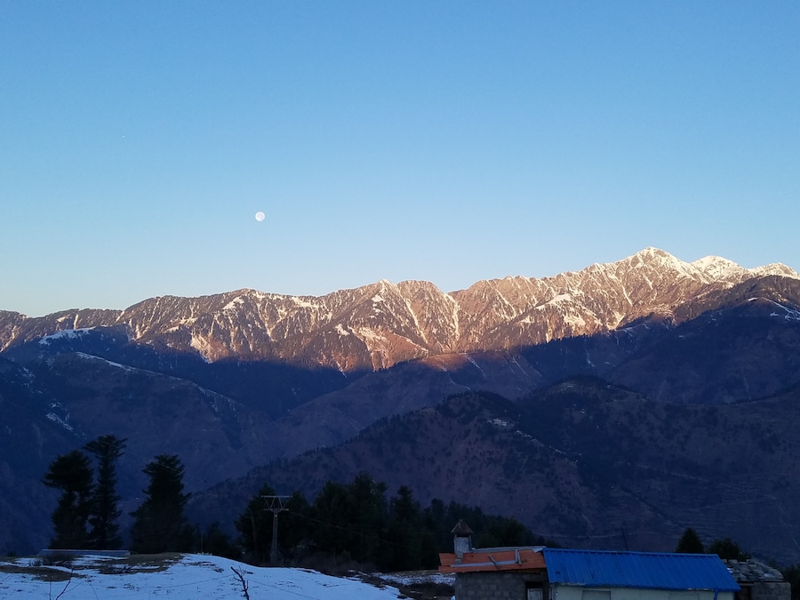 Moon, Sunlight, Snow and Mountains, view from Cedarwood Resort, KPK, Pakistan.