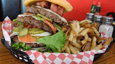 The Ultimate Burger, three 1/2 lb. beef patties with all the trimmings and fries at Back 40 Cafe in Klamath Falls. Awesome burger!

#LikeALocal #GoodEats #TroverFoodies #Trovember