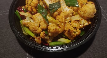 Helens Asian Kitchen is a favorite of Columbus foodies for this dish in particular - stir fried spicy cauliflower. The dish has the right amount of heat to elevate cauliflower from a side to a main course.

Adding more to the mystique of this establishment, their recent relocation has placed them inside the confines of a former strip club.

#Trovember