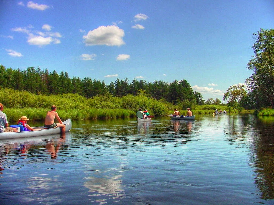 Gentle canoe trip down the Tomahawk River near Rhineland and Mincoqua Wisconsin. Be sure to check river flow before any float trip, and make sure people are trained to operate and steer the boat and know how to paddle. Rivers can be very dangerous when things go wrong.