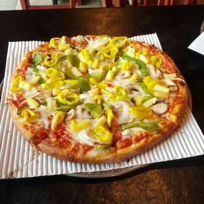 A ridiculously delicious green pepper, banana pepper, onion and pineapple pizza from Michael Angelo's located on the main drag passing through the small town of Kenton.