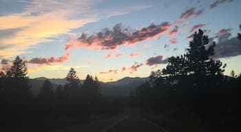 The sunsets over the mountains while driving down little cub creek road.