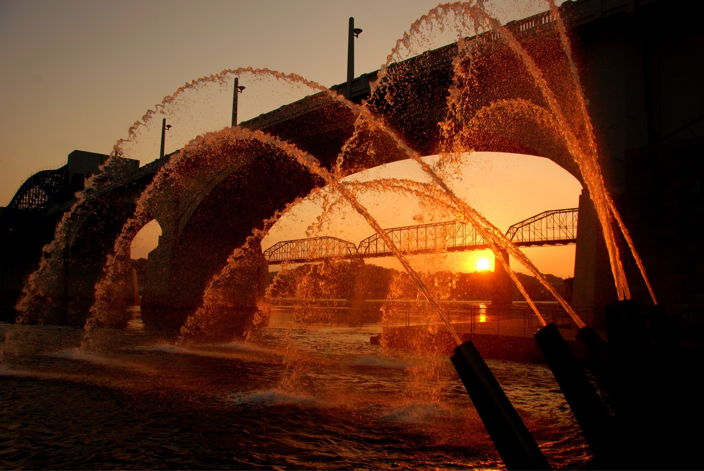 Water cannons at sunrise.