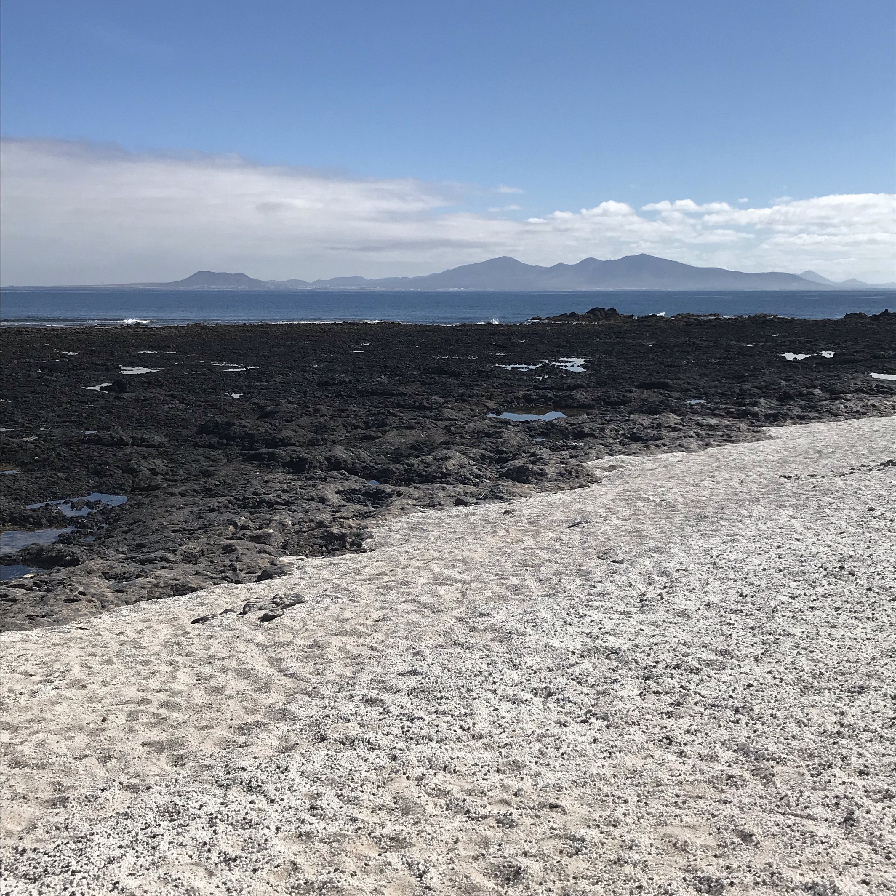 This amazing beach has lots of skeletal calcium carbonate remains of Rhodoliths which is the white ‘stone’. It gives the appearance of popcorn which also gives the beach its name. The island in the distance is Lanzarote.