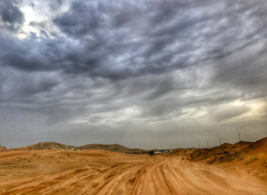 Endless desert, winter rain clouds