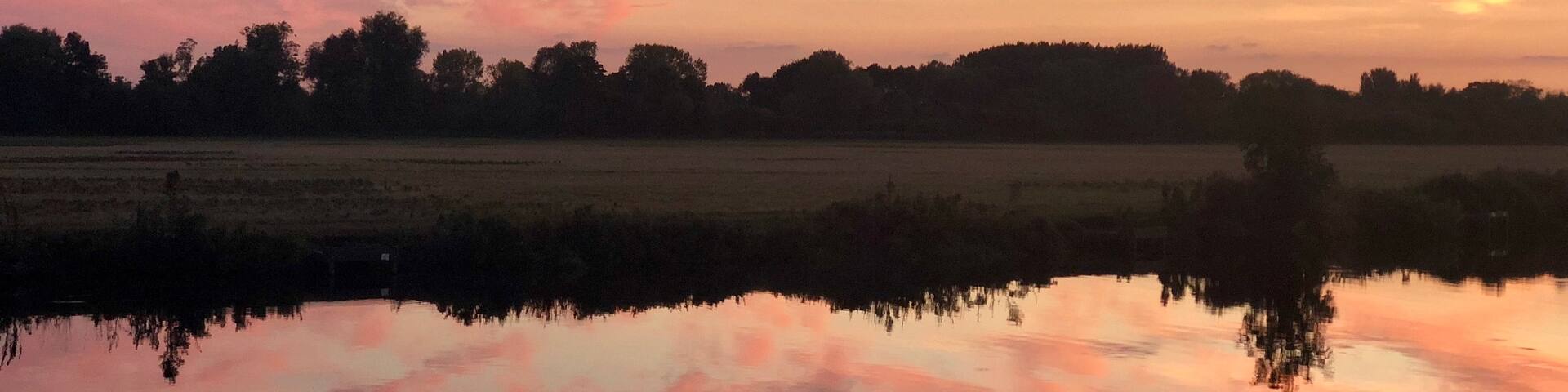 A beautiful sunset and a still river make for a great photo