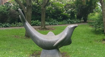 A statue of a playful Porpoise on the grounds of the park.