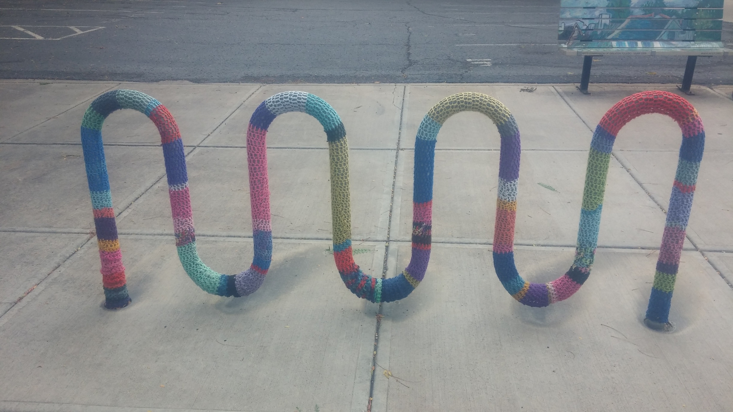 An innocent bike rack is the victim of a yarn-bombing incident. What can be done to curtail such reckless creativity and artistic expression?! 

#YarnBomb