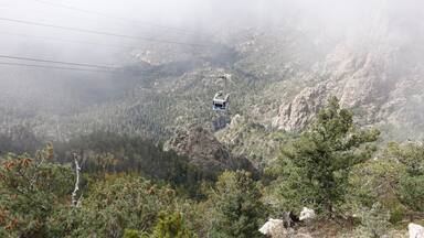 Ride the tram up to Sandia Park in Albuquerque, New Mexico to see some spectacular views. 

A major bonus if you do this around hot air balloon festival week and you will see balloons hovering over the city. However the line/queue to ride the tram from the base can be quite long. 