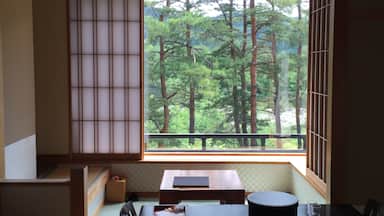 Very fine Japanese styled room with morning sun penetrating through the Washi paper curtain 