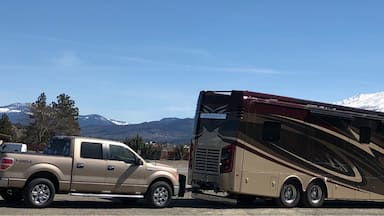 We are full time RVers and I love getting photos of our house in beautiful places!  That’s Mt Shasta looming large in the background at our lunch stop as we head southbound on Interstate 5 in California. #mountains. 