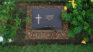 An unknown soldier's grave. 

This place is known by locals as the war cemetery or the Allied cemetery. It is an incredibly well maintained cemetery honoring the soldiers who lost their lives in WWI and WWII. We were overwhelmed by the number of graves and the 27,000 other soldiers who were honored but unable to be buried. If you are in Yangon you should definitely make the trip to the cemetery. 

To get here we took the circle train out of Yangon Central Railway station to the stop Kyaikkale (one after the Golf Course stop). From that station we walked to the road and hailed a taxi. It took 4 or 5 to find someone who could speak enough English to take us there. We paid 8000 Kyat (appr. 8 USD) for the ride there, for him to wait, and for the ride back to the station. It takes about 15-20 minutes in the taxi to get there. The locals use the cemetery more like a park and were more interested in us than anything else. This was irritating but as tourism is so little still it is understandable. Entrance is free.