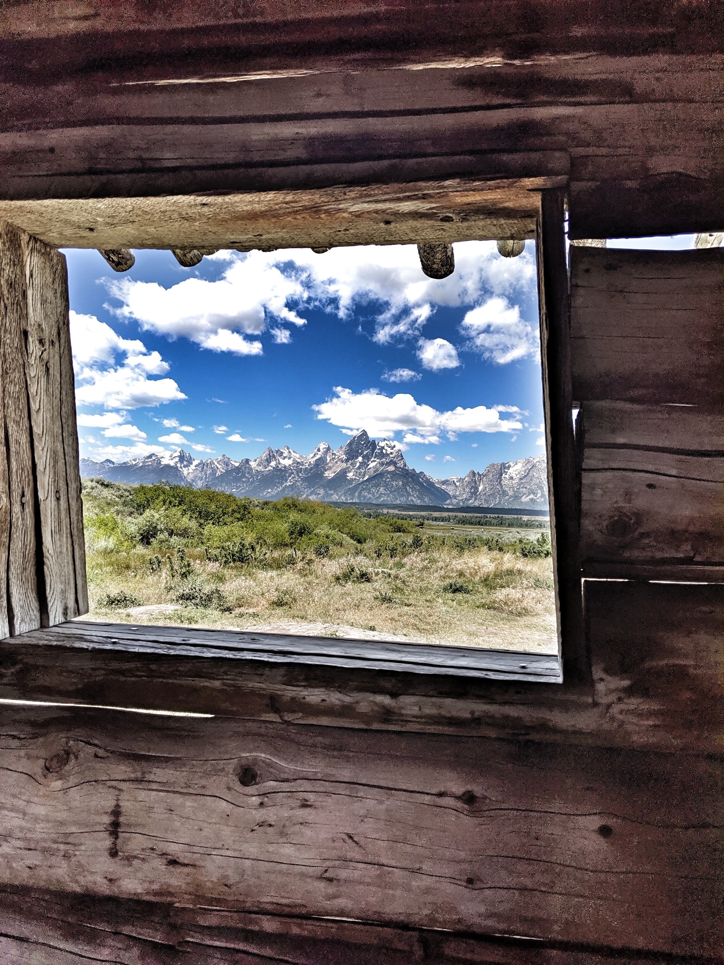 Talk about perfect window placement! Taken from inside the cabin, the Grand Tetons look so magestic, they don't look real! I could have sat for hours looking at that view .
