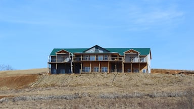 This is another example of the new vs. the old Appalachia through contrasting nature with development.  Instead of a shopping and entertainment center, this is of a newly developed home that is (most likely) hundreds of thousands of dollars.  It sits on a smaller hill, right off highway TN-91 in Wills, TN, an extremely small junction halfway between Laurel Bloomery and Mountain City.  The frame doesn’t contain as much nature as other photos purposely.  The goal in that is to show we can combine the new needs of Appalachia with the old beauty, but at a certain point, the new may strip away ‘too much’ of the old.  #appalachianechoes