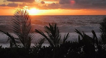 Sunrise on the South Pacific island of Rarotonga.  The island way of life here is something special.  The people have such a joy in life that it's bound to rub off.  

For more, see 'Paradise Found:Why Rarotonga Will Make you  Happy' at: http://www.travelblissnow.com/paradise-found-why-rarotonga-will-make-you-happy/