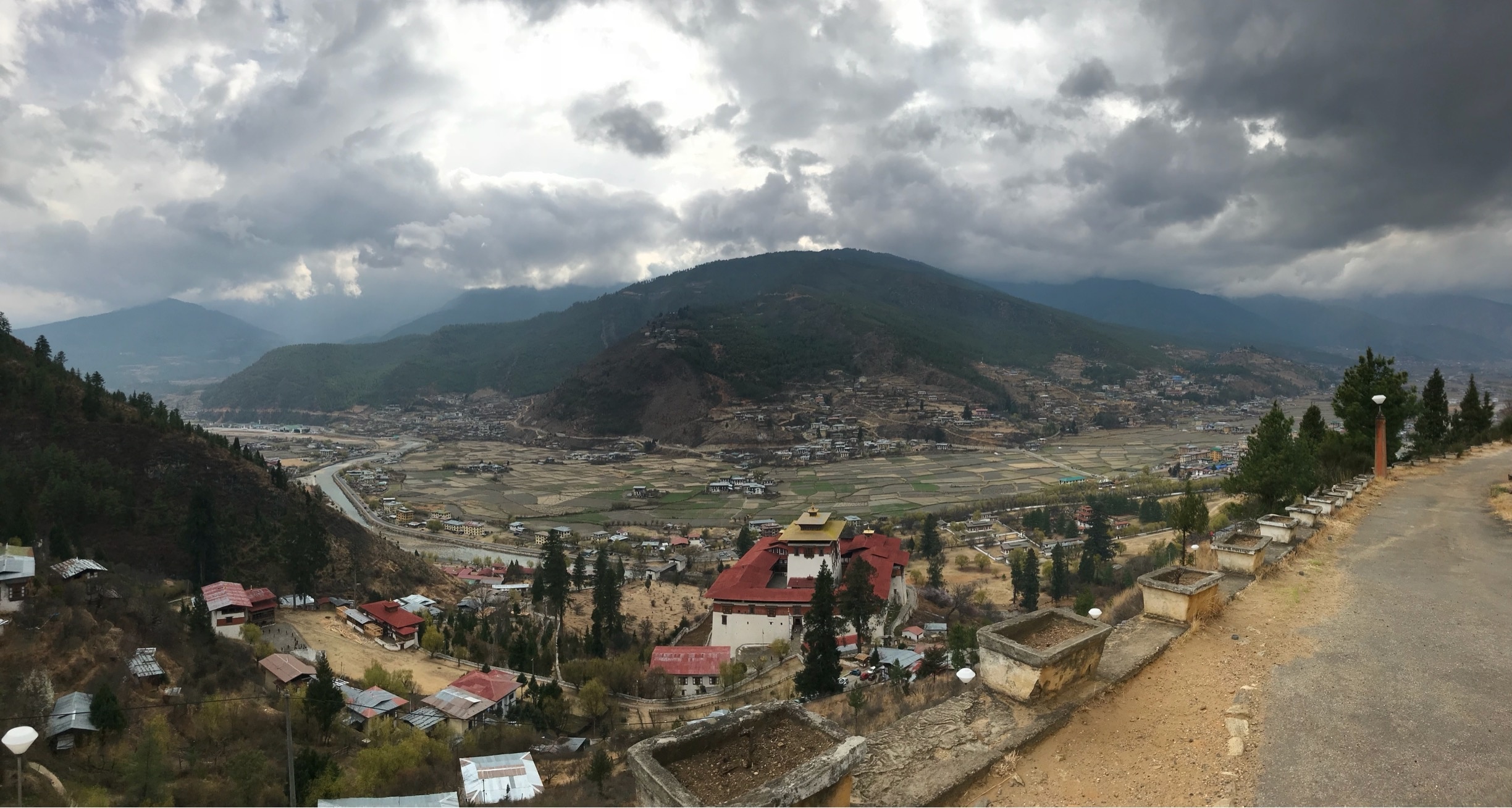The stunning Himalayan town of Paro, Bhutan.  The National Museum located in Paro Dzong is seen in the foreground. #Bhutan #Paro