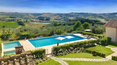 View of the infinity pool and rolling Tuscan hills from room 8 at the most amazing villa in Tuscany!! I can’t recommend this place highly enough. 