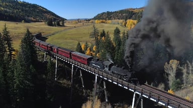 The Cumbres & Toltec is a 3 ft narrow-gauge scenic railroad running for 64 miles between Antonito, Colorado and Chama, New Mexico. Fall scenic tours book fast, plan ahead if you want to catch a ride! #ADVENTURE 