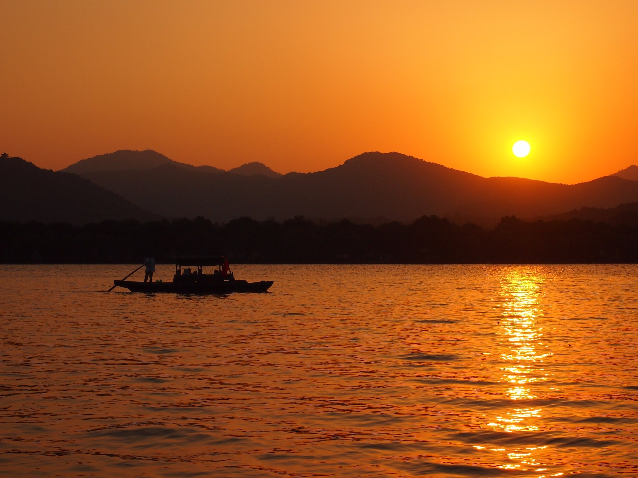 Sunset view of Hangzhou's beautiful West Lake from Xiao Ying island, also called "The three ponds mirroring the Moon".