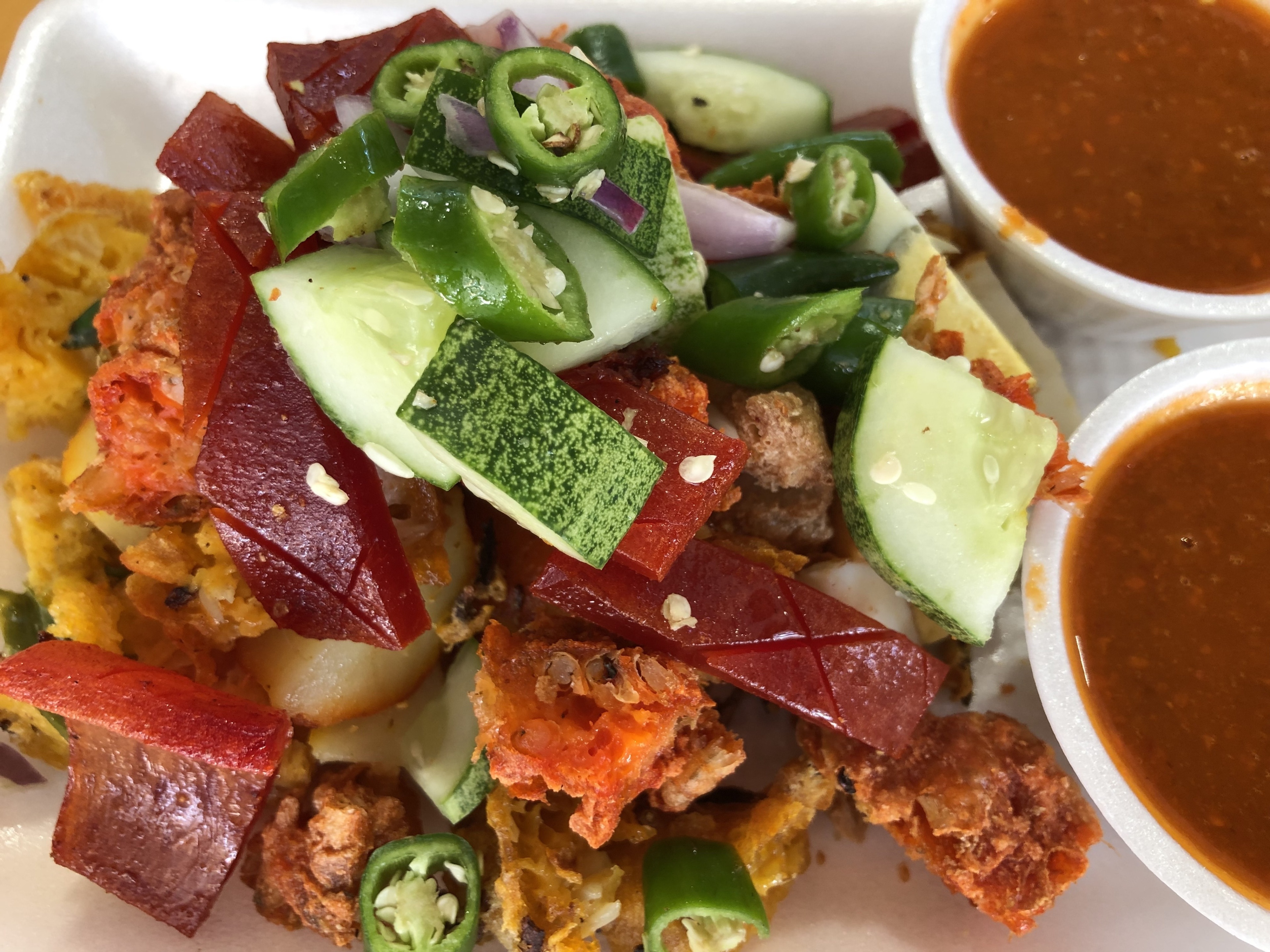 Indian Rojak was created in Singapore by early Indian immigrants. The word “rojak “ means mixed. The dish consists of fried potatoes, fried prawn fritters, fried sausages, onions, chilli and many more, which you can choose whatever you like. The red sauce consists of sweet potatoes and spices. It’s a favourite amongst the locals. 

#TroverFoodies #Culture Photo Contest #Trovember