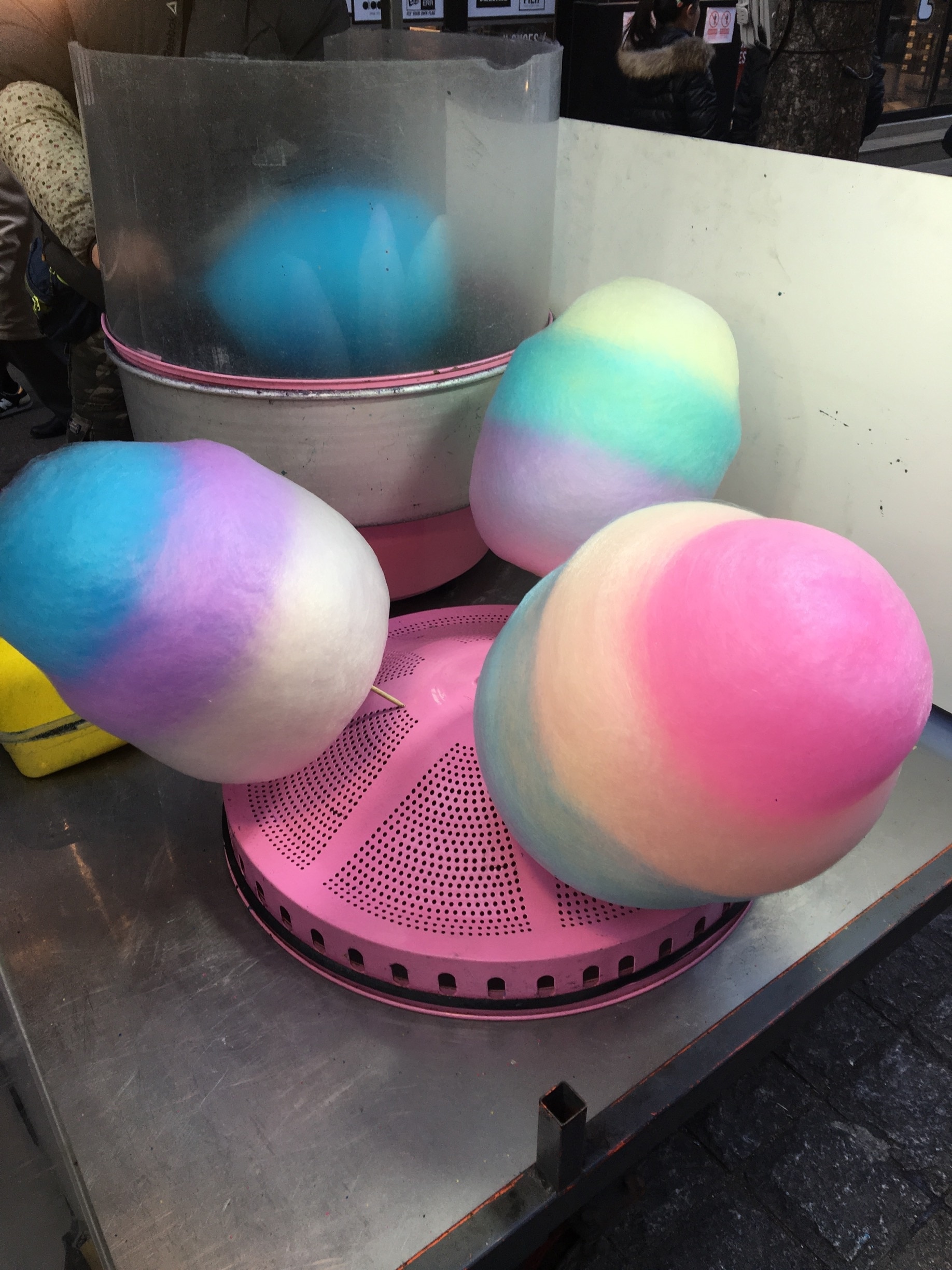These colorful cotton candy are also shaped into flowers !! Street side carts.