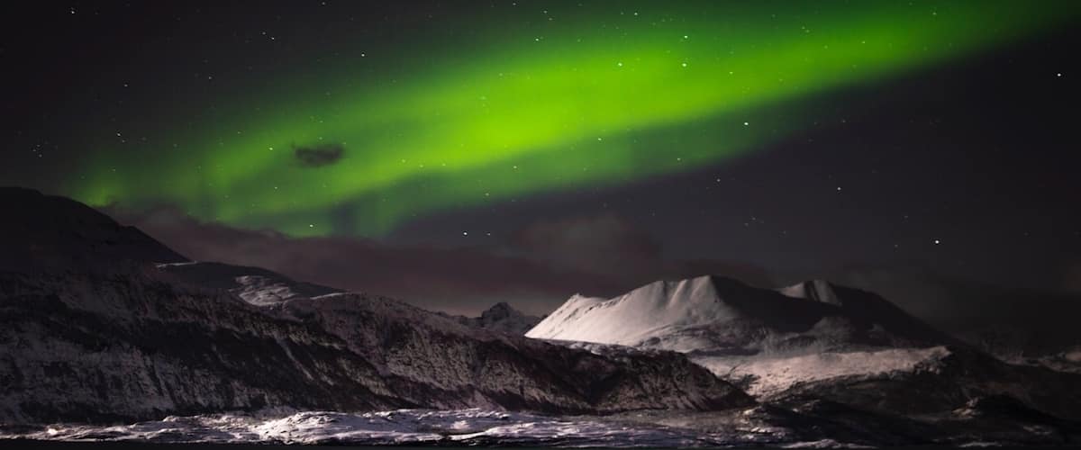 2 hours east of Tromso in the Arctic Circle. This is one of the best places to go to chase the Northern Lights. #northernlights #lights #auroraborealis #skibotn #norway #lifeatexpedia