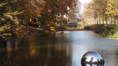The large steel balls were placed in the water, which produces an interesting reflection of the surrounding trees.