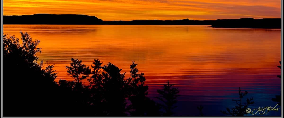 I got this beautiful sunrise from the back porch of our cabin while staying at Captain Cook's Cottages in York Harbour, NL. This shot was taken overseeing The Bay of Islands. I loved our stay at Captain Cook's Cottages and intend on going back. The owners are wonderful hosts and I have much more to see there.
