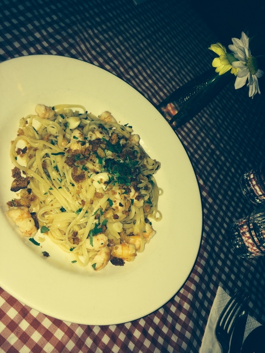 Awesome Italian, friendly fun ..., prawn linguine with oodles of garlic. Yum 