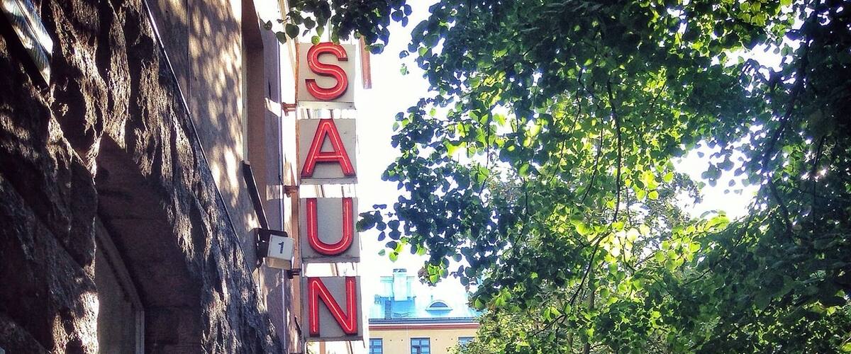 If you are in Helsinki, Finland, you have to try a sauna! It's a fantastic way to relax after a long day of visiting the city. 
Getting completely naked amidst a group of strangers may sound intimidating, but it's really not such a big deal once you do it. Locals enjoy meeting their friends at the sauna for a chat, much like I might meet up with my friends for a coffee at home. There's nothing sexual about it, and men and women have separate saunas. Even though it can be a bit strange for visitors at first, once you relax the sauna is a wonderfully enjoyable experience. 
You sit in the hot, dark room until it gets too warm to bear. Then, you duck out for a quick cooling shower, or a roll in the snow if it's winter! You can also play games or have a beer with your friends outside in between steaming sessions. Finish off with a long shower and a shot of vodka for the complete experience!