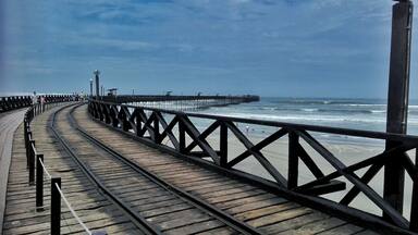 Pimentel port in Chiclayo City. You can see the rails byte where the train passed to the end of the port. #blue
