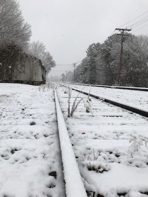 Peaceful afternoon, as a dusting of snow fell upon the tracks. Old Clemmons Station in the background.