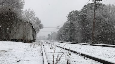 Peaceful afternoon, as a dusting of snow fell upon the tracks. Old Clemmons Station in the background.
