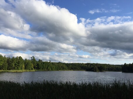 value: "The lake at Pattison State Park. Beautiful to sit by in the late afternoon. Nice CCC buildings to check out too. You can walk to both big and little manitou falls from the lake on beautiful hiking trails. "
