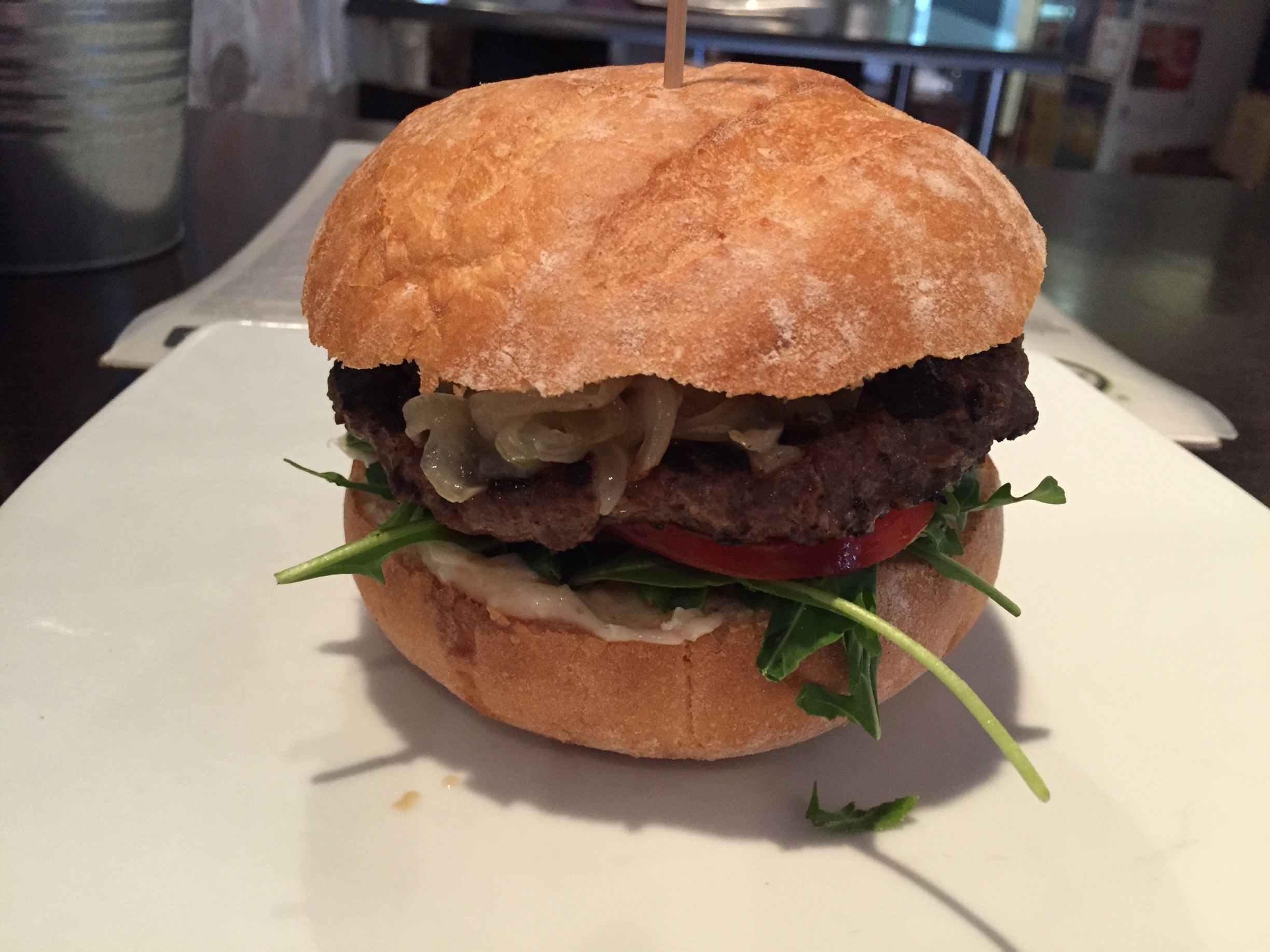 My first time trying a kangaroo burger. Served with caramelized onions, greens, tomatoes, and beetroot relish. Pretty good.