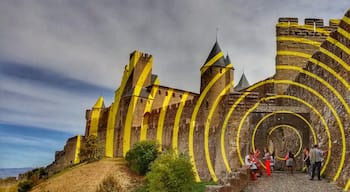 This is one of the entryways to the medieval city at Carcassonne. When I visited, it had this art installation - those circles are physically there! 