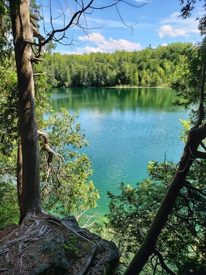 Land owned by the Crawford family in the 1800s, built a lumber mill at the end of the lake and later used as a summer retreat. Years later, sold to Conservation Halton for preservation of the beautiful lake!