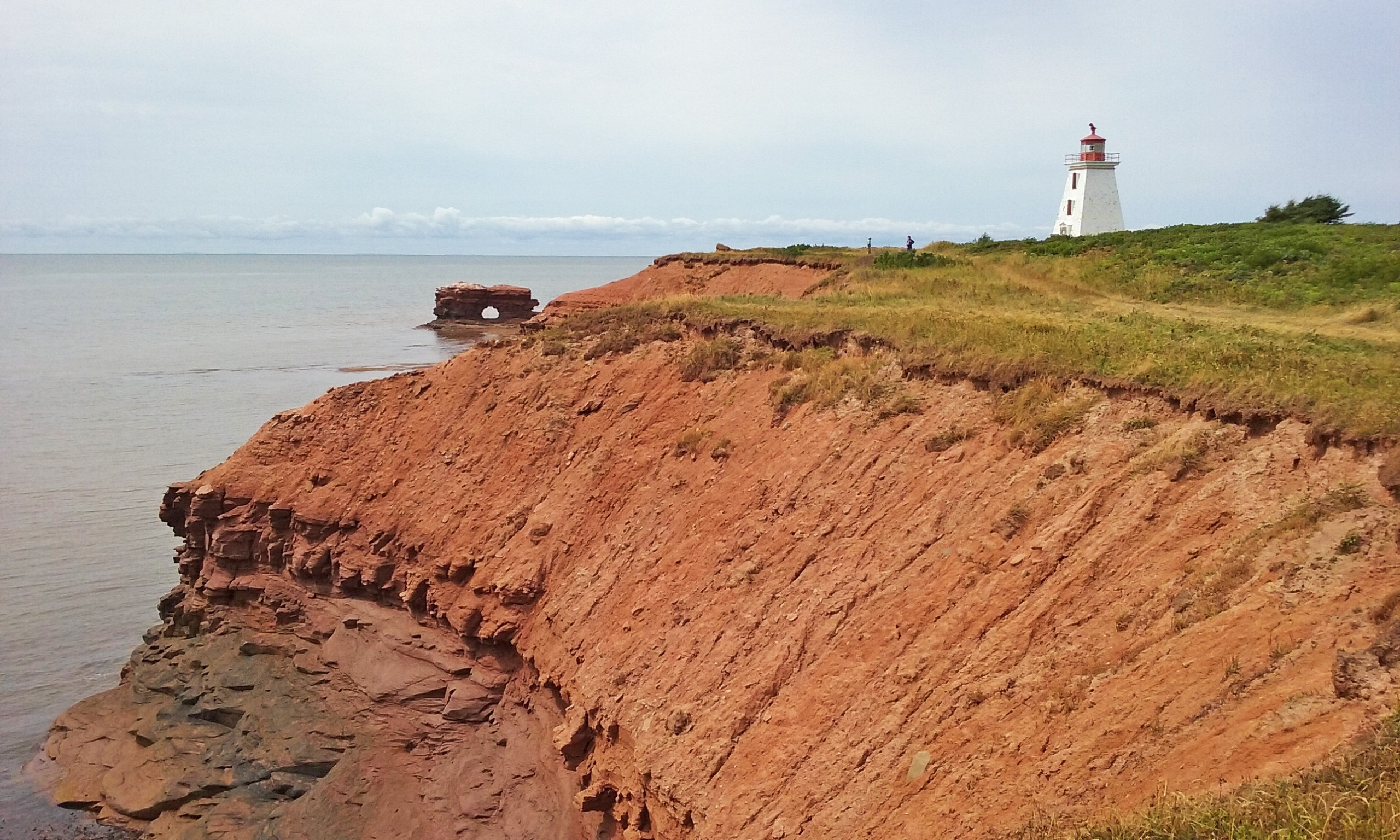Cape Egmont's lighthouse overlooks a natural rock arch. #beachtips