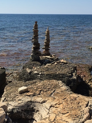 Beautiful quiet beach in a little village between Umag and Karigador, Istria..found these two little structures forming a lovely focus of the clear waters...