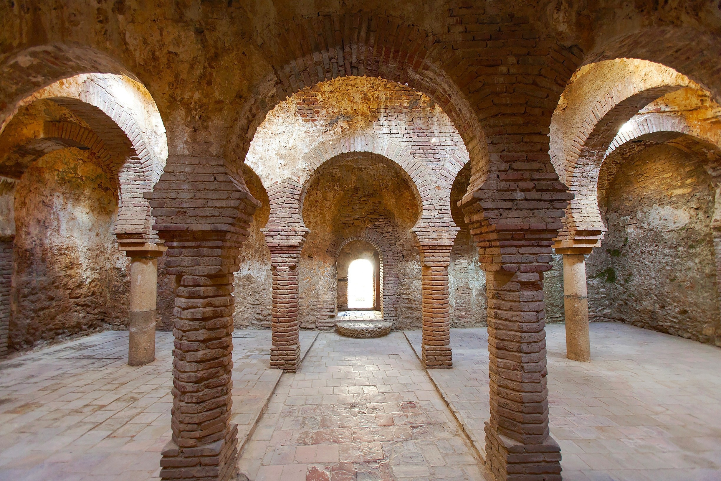These 11th-century Arab baths are some of the best preserved in Europe.  They are situated outside the city walls near the oldest bridge, as it was a Muslin custom back then to purified one's self before entering the city.  You can visit the chambers - hot, mild, cold - and watch a short video detailing how they were stream fed and temperature-controlled.