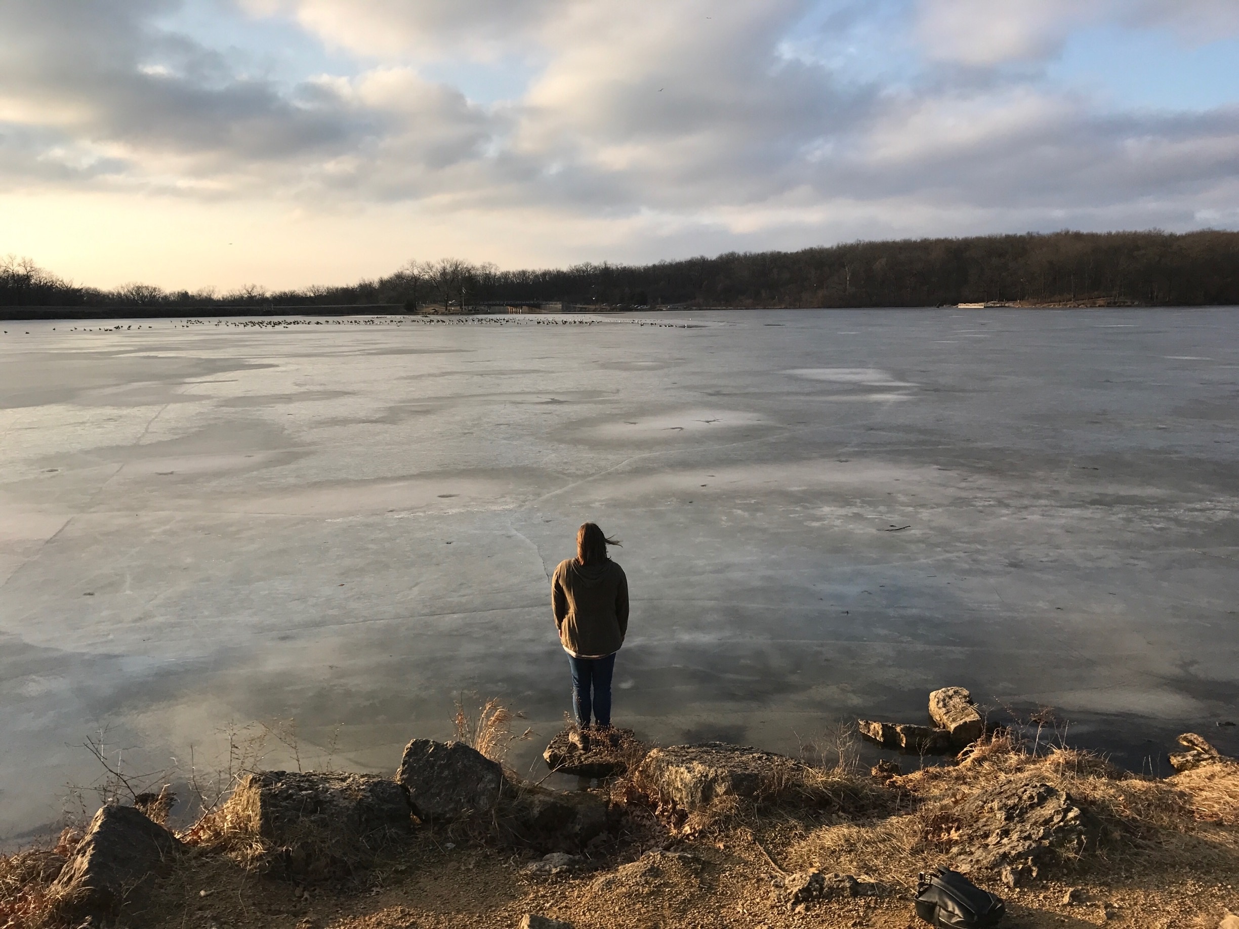 I took this of my Twin sister. I love how the frozen lake looks at this time of day. 