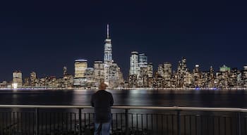 “The Long Exposure Selfie” 
This is the view of New York City’s downtown financial district as seen from Jersey City, New Jersey. The Freedom Tower stands mightily over the Hudson River where US Airways Flight 1549 had to make an emergency landing after losing both engines to bird strikes. It has popularly come to be known as “The Miracle On The Hudson”. This sight is less than half a mile from the Exchange Place Path train station. One can also reach this place via the New York Water Taxi Service. This place is truly a sight to behold and should be on everyone’s itinerary when visiting The Big Apple! 