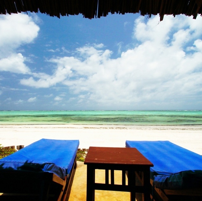 Cabana view of Bwejuu Beach on the east coast of Zanzibar. This luxury resort is a wonderful place to relax after a couple weeks of safari. Either that, or host a small destination wedding here - the white sand beach has been rated one of the best in the world and, due to it's remote location, is never crowded. In fact, The Palms only has six large bungalows while the neighboring property, Breezes, has 60 rooms. Otherwise, the beach is yours to share with the few locals who wander by.