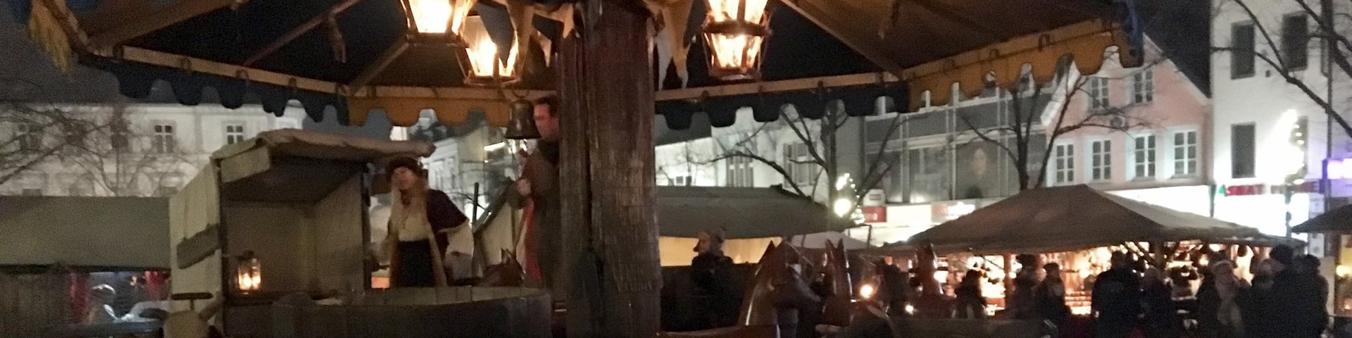 The Siegburg Weihnachtsmarkt (Christmas market) is medieval themed. This is a hand-cranked wooden carousel life you candles in the lanterns hanging from the top.