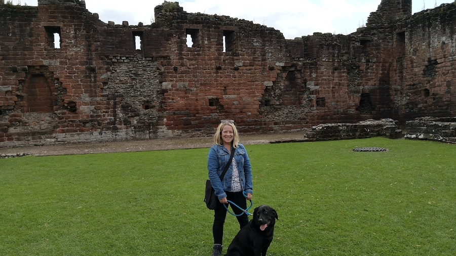 Red ruins of a Castle in the market town of Penrith. There's also a park with bandstand & cafe.
